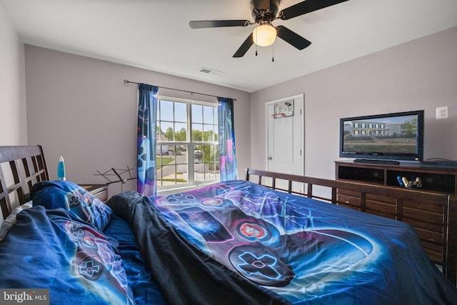bedroom with ceiling fan and visible vents