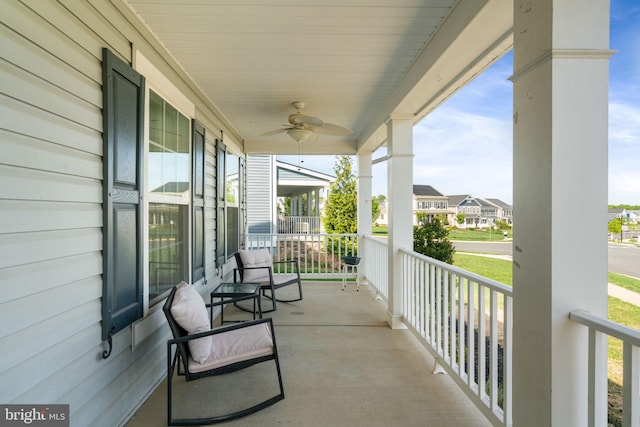 balcony with a ceiling fan and a porch
