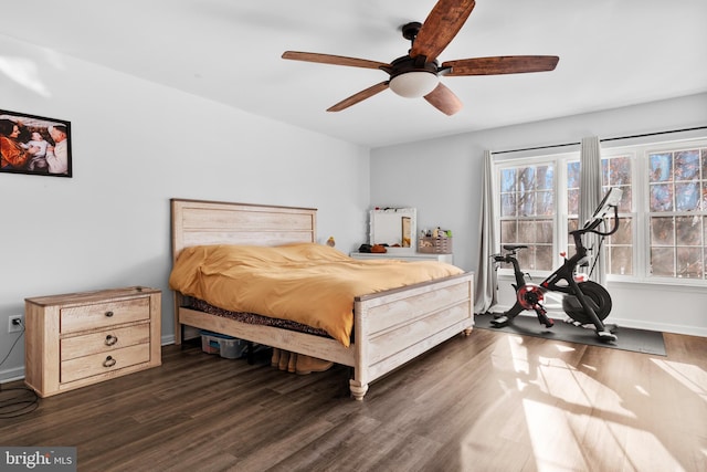 bedroom with ceiling fan and dark hardwood / wood-style flooring