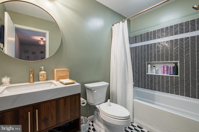 full bathroom featuring shower / bath combo, vanity, and toilet