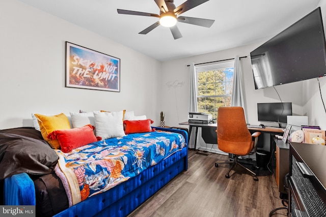 bedroom featuring hardwood / wood-style floors and ceiling fan