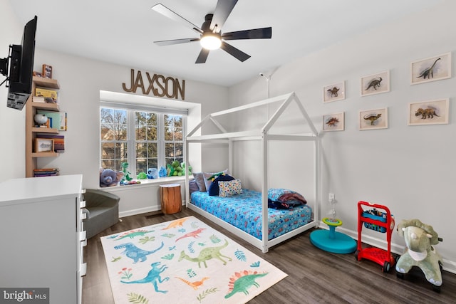 bedroom with dark wood-type flooring and ceiling fan