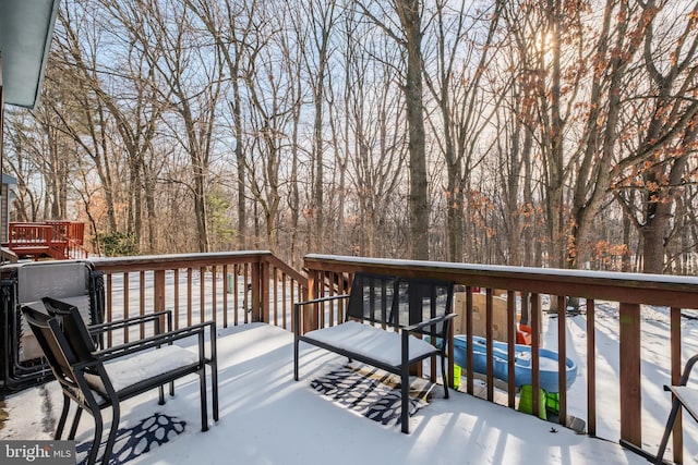 view of snow covered deck