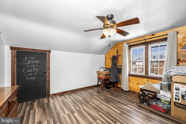 interior space featuring vaulted ceiling, dark hardwood / wood-style floors, and ceiling fan