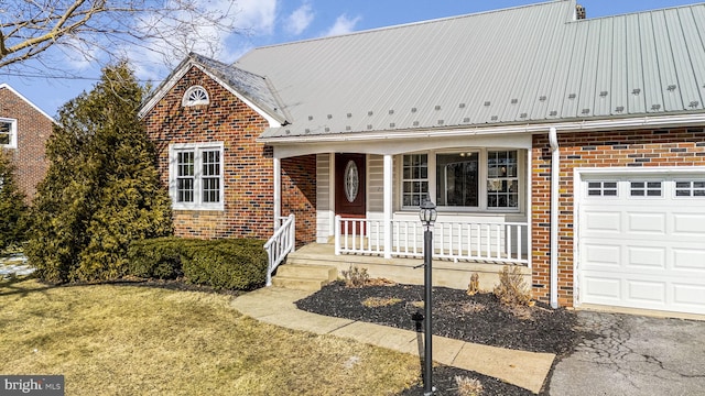 view of front facade with a porch, a garage, and a front lawn