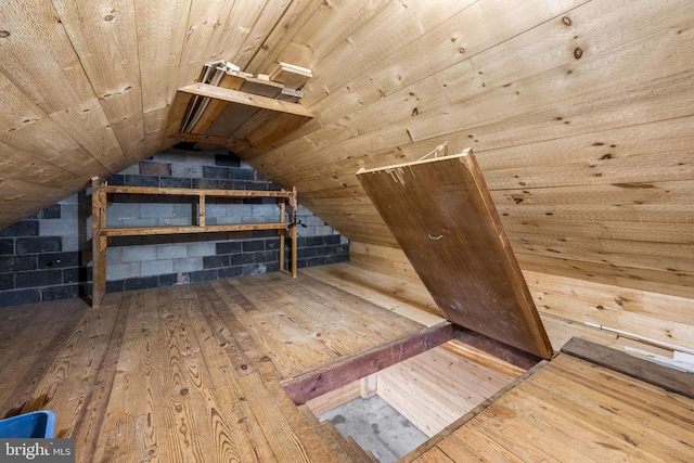 interior space featuring vaulted ceiling, hardwood / wood-style floors, and wooden ceiling