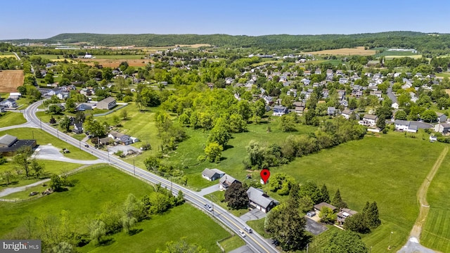 aerial view of property's location with nearby suburban area