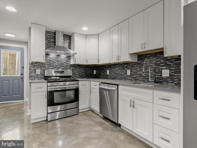 2437 Fleet St, Baltimore, MD 21224 - kitchen with stainless steel appliances, wall chimney range hood, finished concrete floors, a sink, and recessed lighting