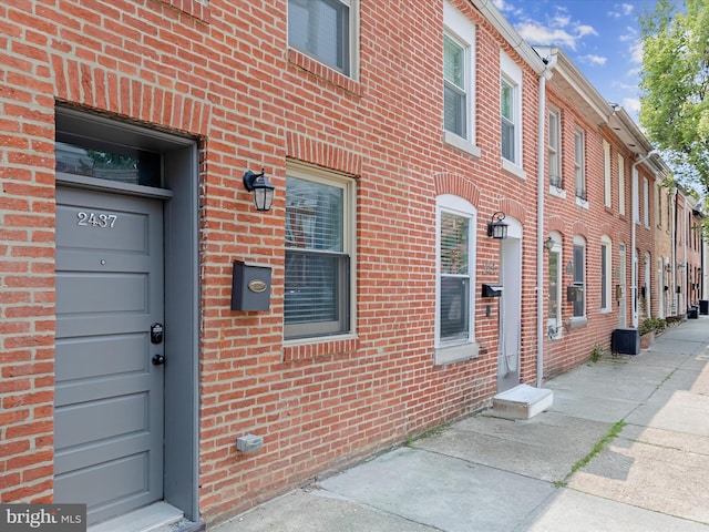 2437 Fleet St, Baltimore, MD 21224 - doorway to property with brick siding