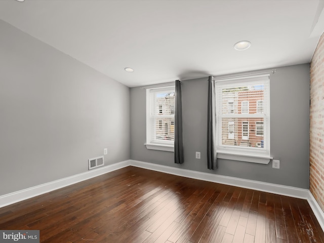 2437 Fleet St, Baltimore, MD 21224 - unfurnished room with baseboards and dark wood-type flooring