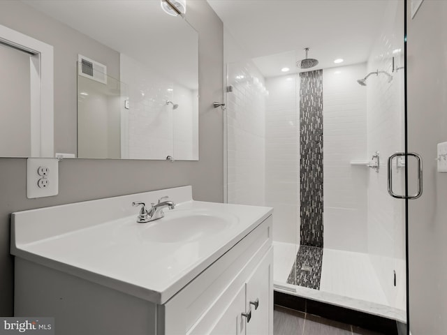 2437 Fleet St, Baltimore, MD 21224 - bathroom with a shower stall, vanity, and recessed lighting