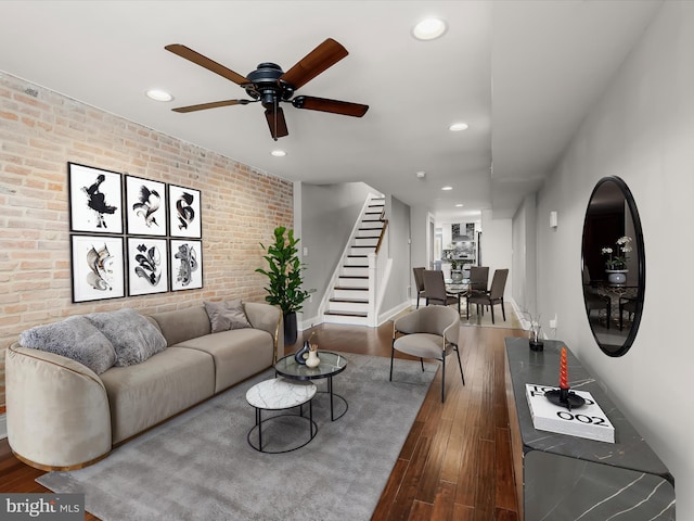 2437 Fleet St, Baltimore, MD 21224 - living area featuring brick wall, stairs, recessed lighting, ceiling fan, and wood finished floors