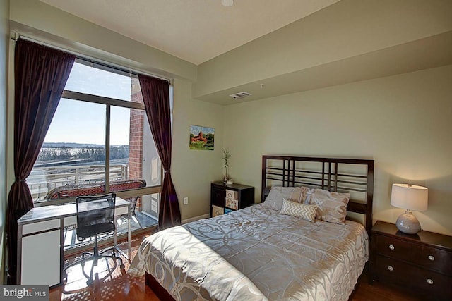 bedroom with hardwood / wood-style floors