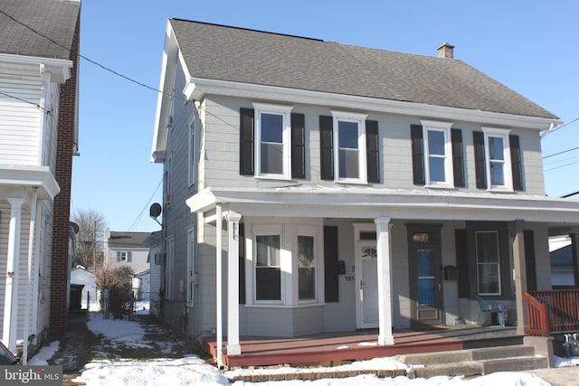 view of front of property featuring covered porch