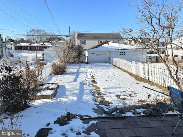 view of yard layered in snow