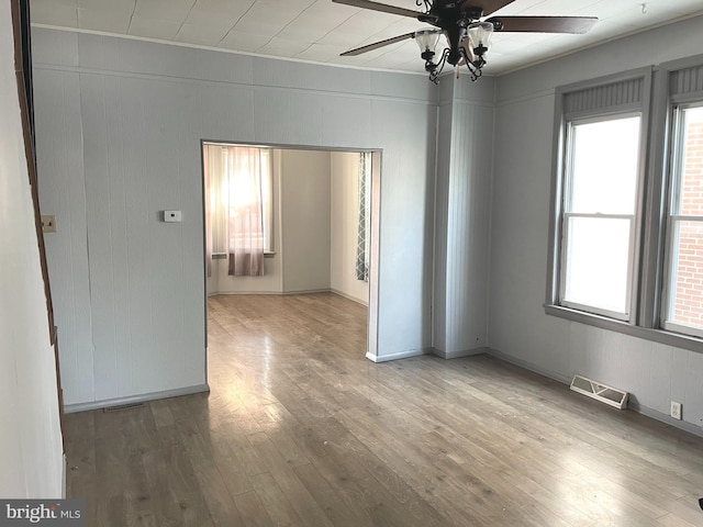 unfurnished room featuring wood-type flooring and ceiling fan