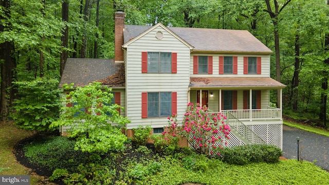 7210 James I Harris Memorial Dr, Frederick, MD 21702 - view of front of home with covered porch, a chimney, and stairs