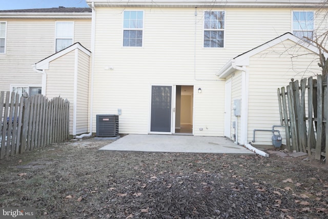 back of house with cooling unit and a patio area