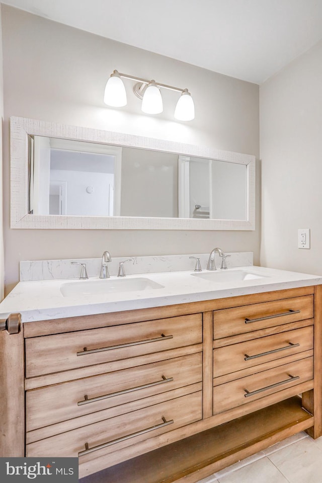 bathroom featuring vanity and tile patterned flooring