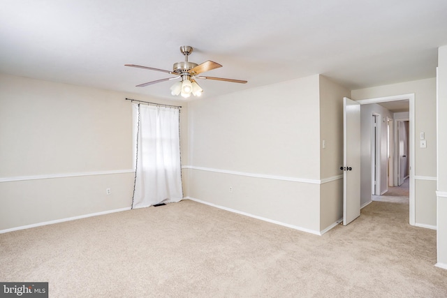 empty room with light carpet and ceiling fan