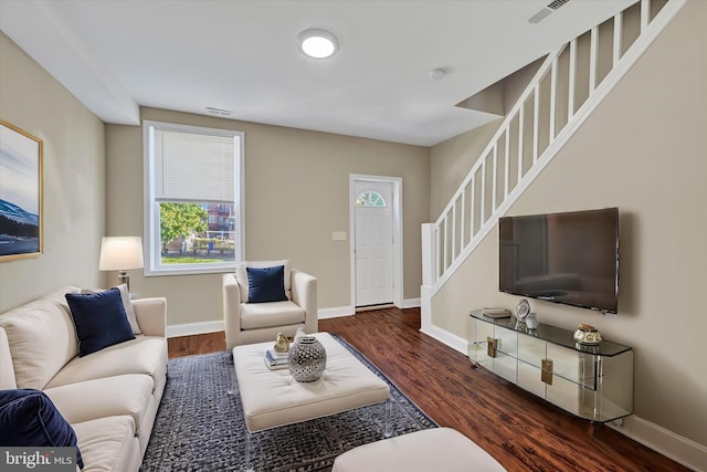 living room with dark hardwood / wood-style floors