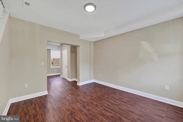 unfurnished room featuring dark hardwood / wood-style floors