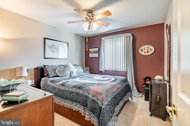 bedroom featuring ceiling fan and light carpet