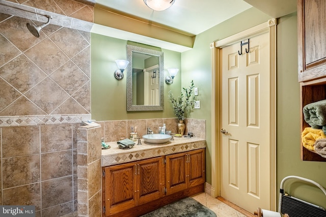full bath with backsplash, tile patterned floors, and vanity