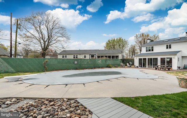 view of pool featuring a patio and fence private yard