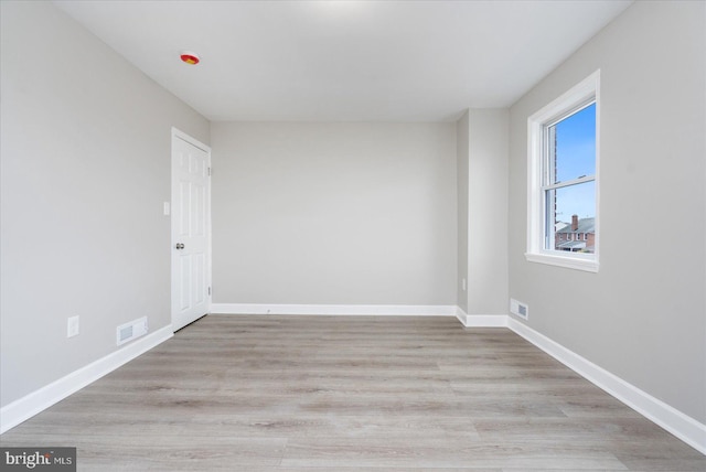 unfurnished room with light hardwood / wood-style flooring