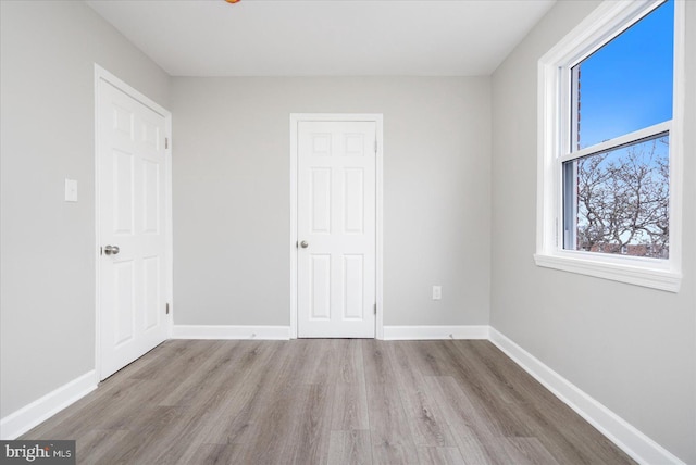 unfurnished bedroom featuring light wood-type flooring