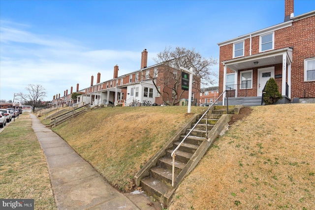 view of front of house featuring a front lawn and a porch