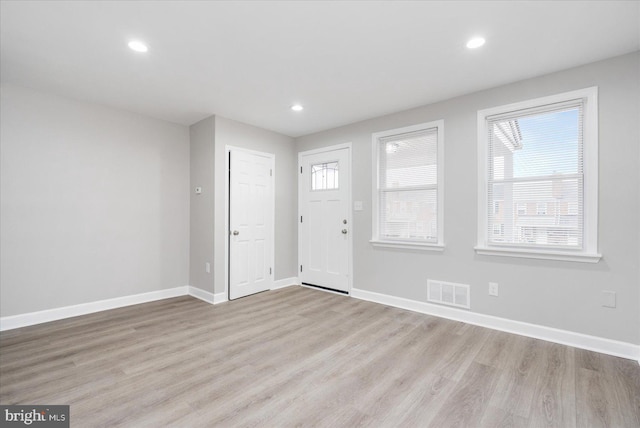 entryway with light hardwood / wood-style flooring