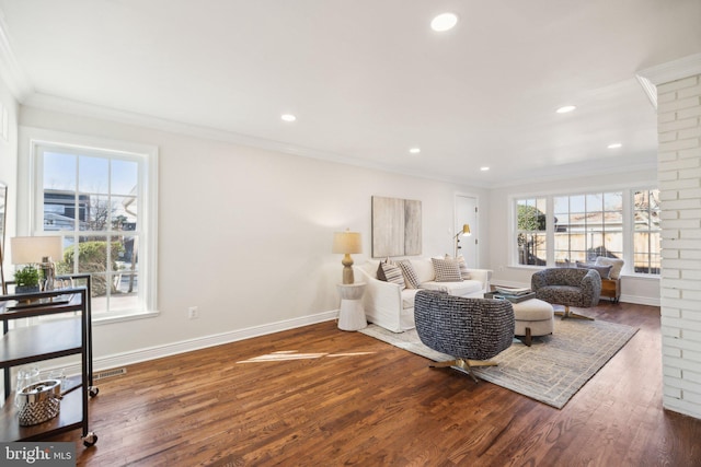 living room featuring ornamental molding and dark hardwood / wood-style floors