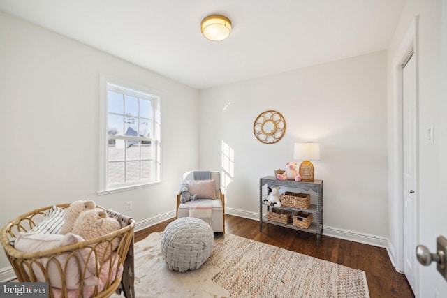 sitting room with a healthy amount of sunlight and dark hardwood / wood-style floors