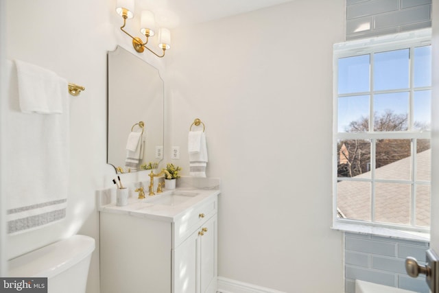 bathroom featuring vanity and toilet