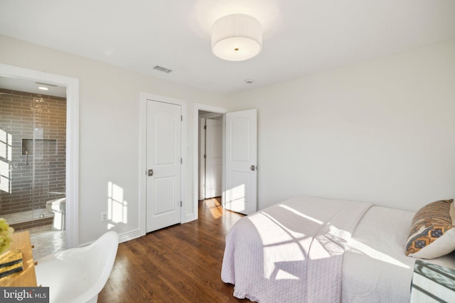 bedroom featuring dark wood-type flooring