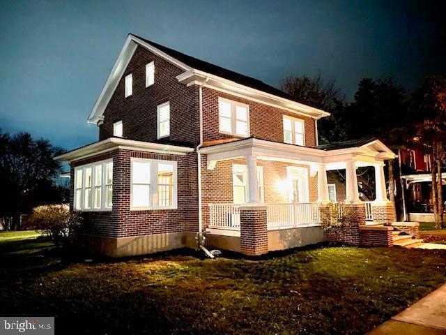 view of property exterior with a porch