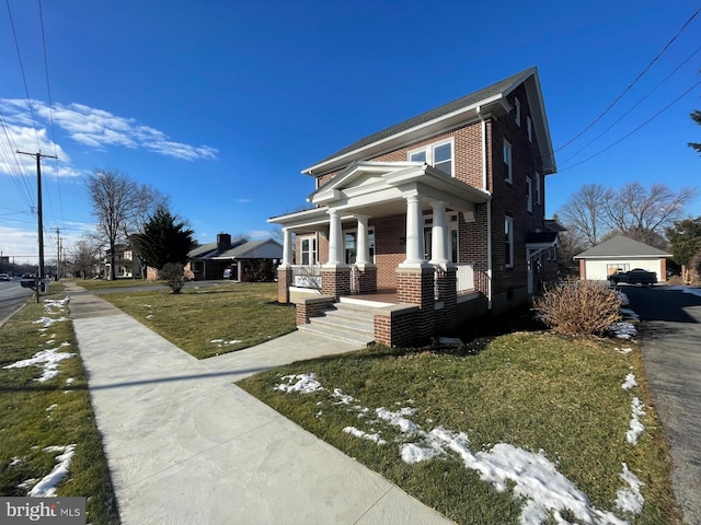 view of front of house with a front yard and covered porch