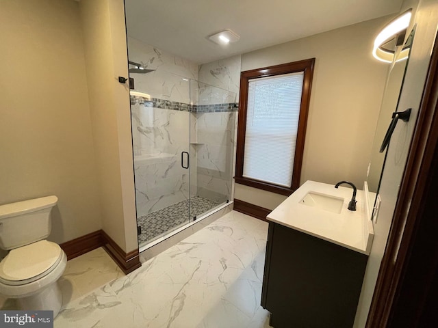 bathroom featuring vanity, an enclosed shower, and toilet