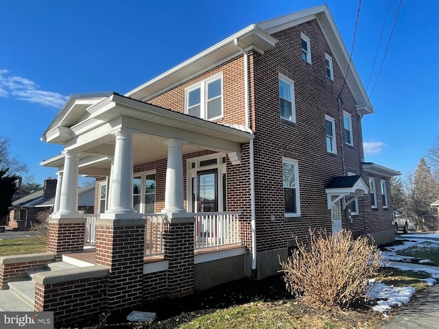 view of property exterior with covered porch