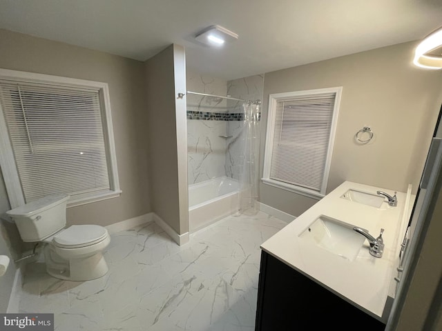 full bathroom with vanity, shower / tub combo, and toilet