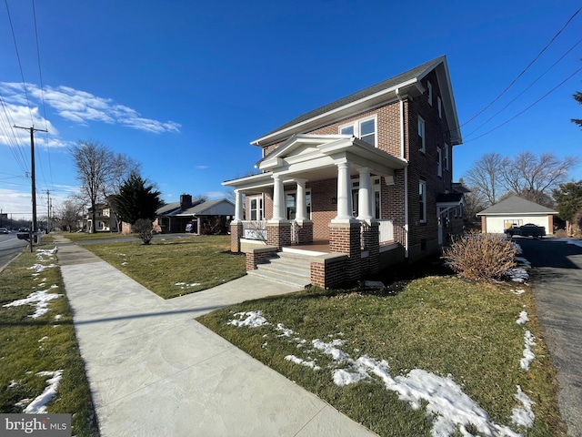 view of front of house featuring covered porch and a front yard