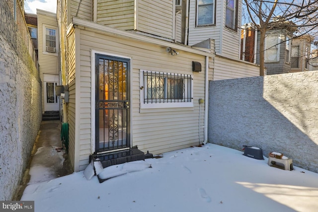 view of snow covered property entrance