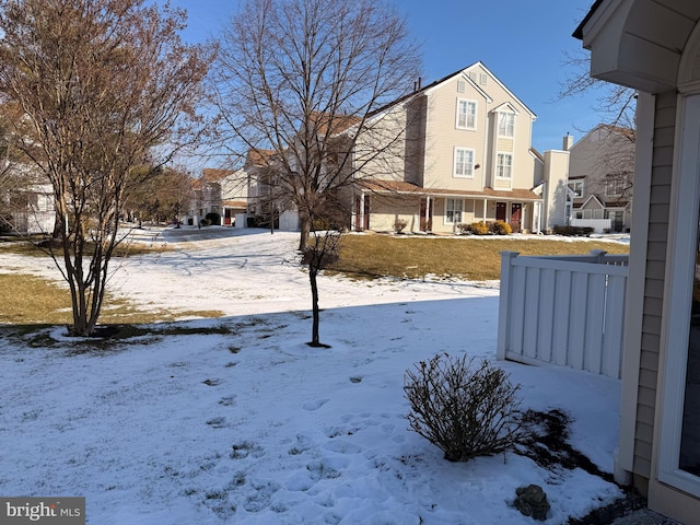 view of yard covered in snow