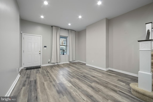 unfurnished living room with hardwood / wood-style floors