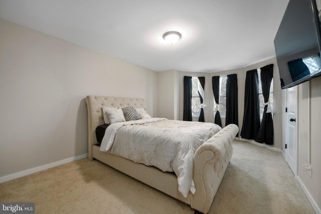 bedroom with light colored carpet