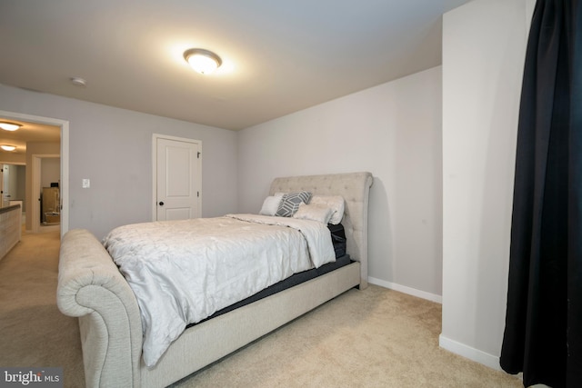 bedroom with light colored carpet