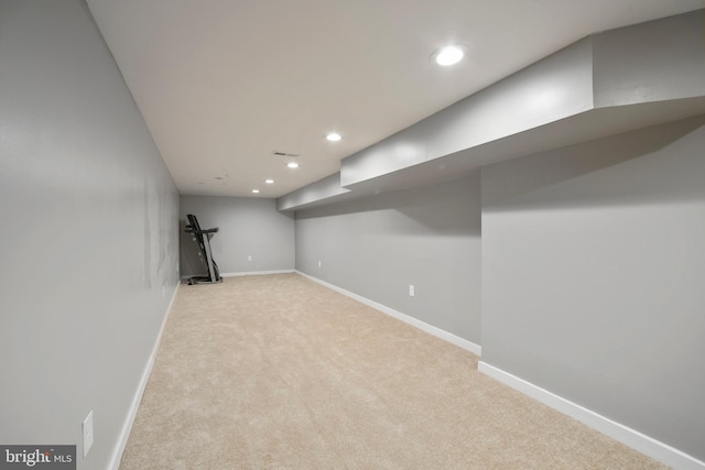 basement with light colored carpet