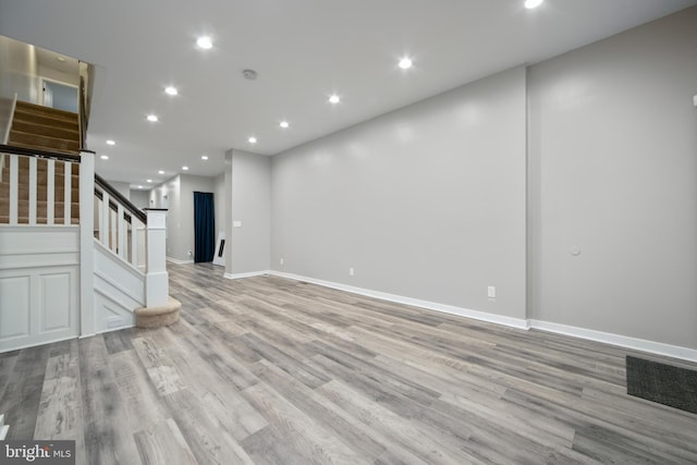 unfurnished living room with light hardwood / wood-style floors